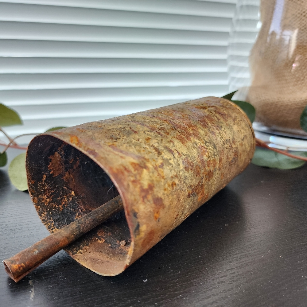 Authentically vintage Rustic metal cow bell with patina and working clapper